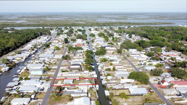 aerial view with a residential view and a water view