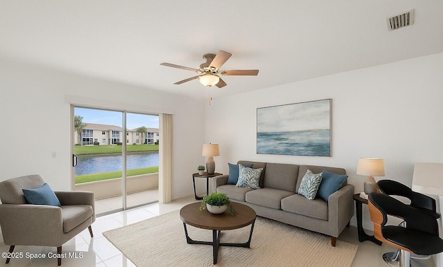 927 Ocaso Ln Unit 102, Rockledge, FL 32955 - living area with ceiling fan and a water view