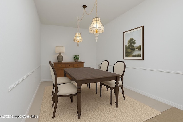 927 Ocaso Ln Unit 102, Rockledge, FL 32955 - dining space with baseboards