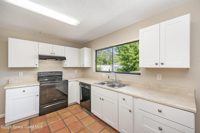 kitchen featuring a sink, white cabinetry, under cabinet range hood, and black appliances