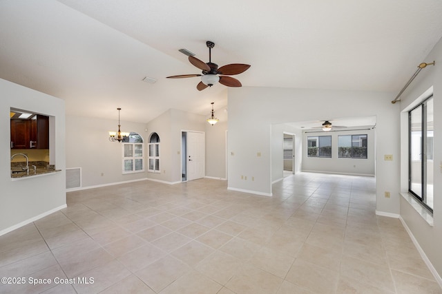 unfurnished living room featuring visible vents, lofted ceiling, light tile patterned floors, and ceiling fan with notable chandelier