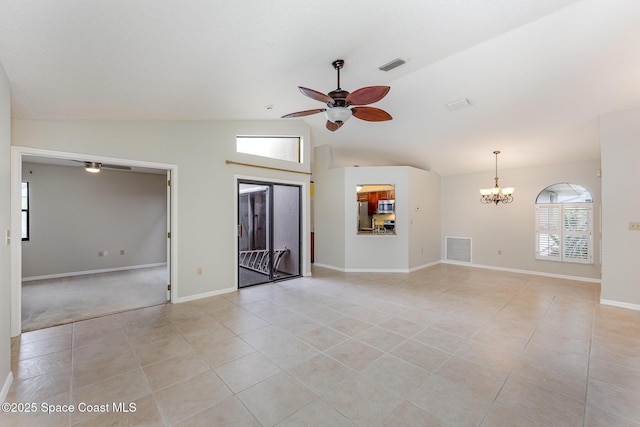 unfurnished living room with light tile patterned floors, vaulted ceiling, ceiling fan with notable chandelier, and visible vents