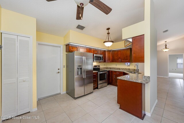 kitchen featuring a sink, appliances with stainless steel finishes, light tile patterned floors, and visible vents