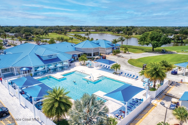 bird's eye view featuring view of golf course and a water view