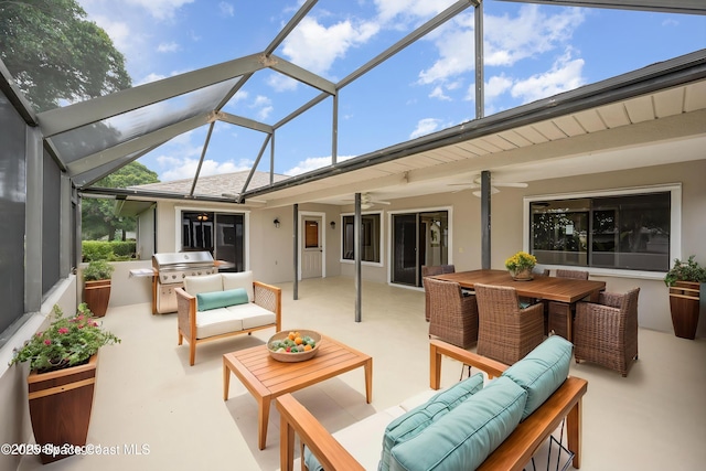 exterior space featuring an outdoor hangout area, outdoor dining space, exterior kitchen, and a ceiling fan
