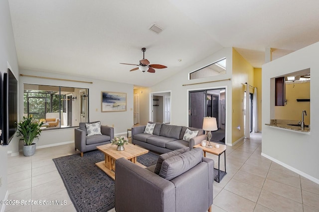 living area featuring light tile patterned floors, ceiling fan, lofted ceiling, and visible vents
