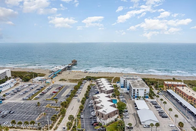 aerial view featuring a water view and a view of the beach