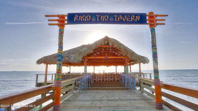 view of dock featuring a gazebo and a water view
