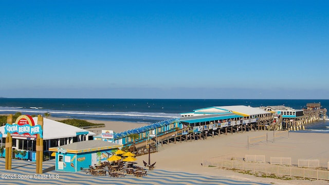 bird's eye view featuring a water view and a view of the beach