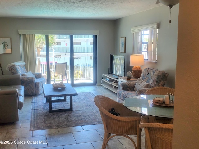 5350 Ocean Beach Blvd Unit 207, Cocoa Beach, FL 32931 - living area with plenty of natural light