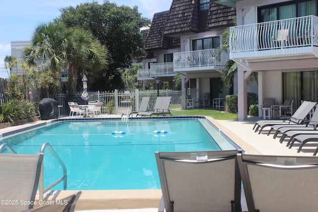 5350 Ocean Beach Blvd Unit 207, Cocoa Beach, FL 32931 - community pool featuring a patio and a grill