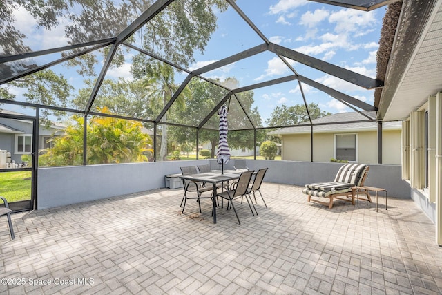 view of patio with a lanai