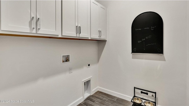 clothes washing area with cabinet space, dark wood-style flooring, washer hookup, baseboards, and hookup for an electric dryer