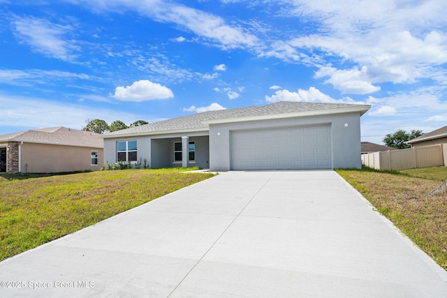 single story home featuring an attached garage, stucco siding, driveway, and a front yard