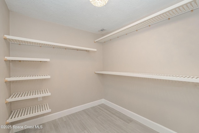 451 Bridgetown Ct, Satellite Beach, FL 32937 - spacious closet featuring wood finished floors