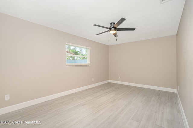 451 Bridgetown Ct, Satellite Beach, FL 32937 - empty room with light wood finished floors, ceiling fan, and baseboards