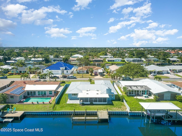 451 Bridgetown Ct, Satellite Beach, FL 32937 - aerial view of residential area with a pool and a nearby body of water