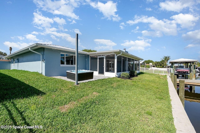 451 Bridgetown Ct, Satellite Beach, FL 32937 - rear view of property with a sunroom, a gazebo, and stucco siding