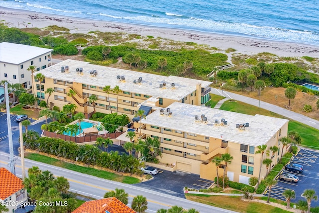 drone / aerial view of waterfront with a beach