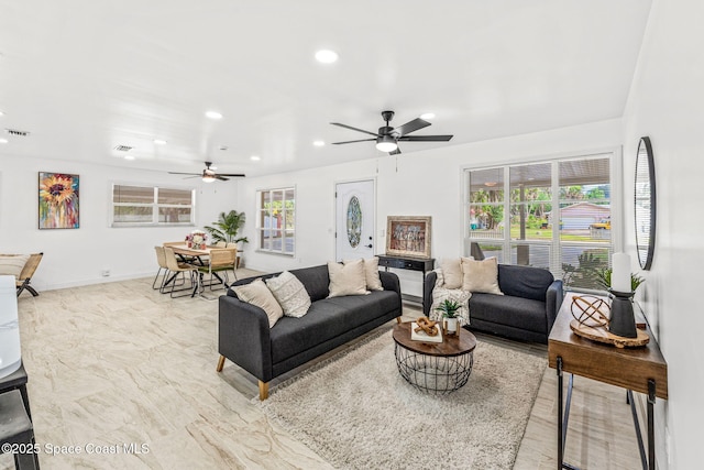 living room featuring recessed lighting, a ceiling fan, baseboards, and visible vents