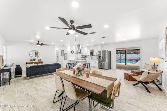 dining room with a ceiling fan, visible vents, and recessed lighting