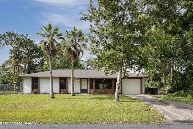 single story home featuring fence, a front yard, roof with shingles, an attached garage, and driveway