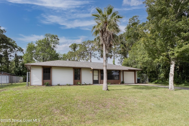 ranch-style house featuring fence, a front yard, and a garage