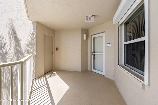 602 Shorewood Dr Unit A201, Cape Canaveral, FL 32920 - property entrance featuring stucco siding and a balcony