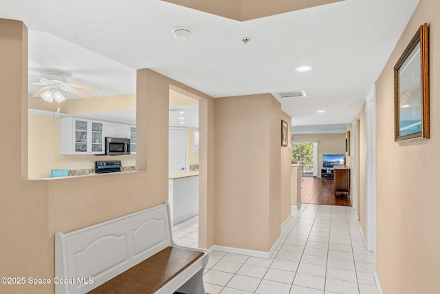 602 Shorewood Dr Unit A201, Cape Canaveral, FL 32920 - corridor featuring light tile patterned flooring, baseboards, and recessed lighting