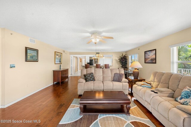 602 Shorewood Dr Unit A201, Cape Canaveral, FL 32920 - living room featuring hardwood / wood-style flooring, ceiling fan, baseboards, and a chandelier