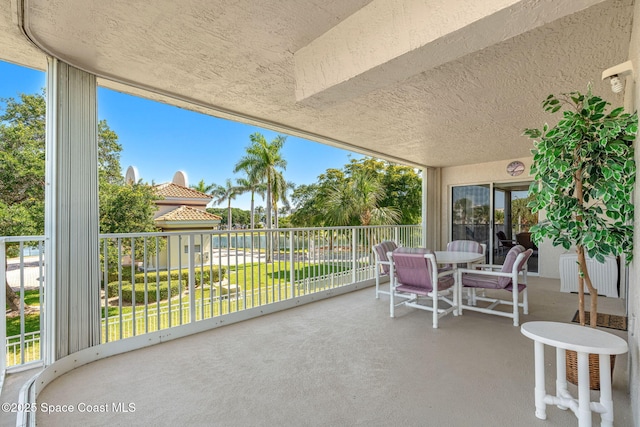 602 Shorewood Dr Unit A201, Cape Canaveral, FL 32920 - view of patio featuring a balcony and outdoor dining area