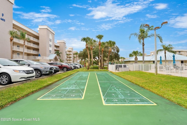 602 Shorewood Dr Unit A201, Cape Canaveral, FL 32920 - view of community featuring uncovered parking and shuffleboard