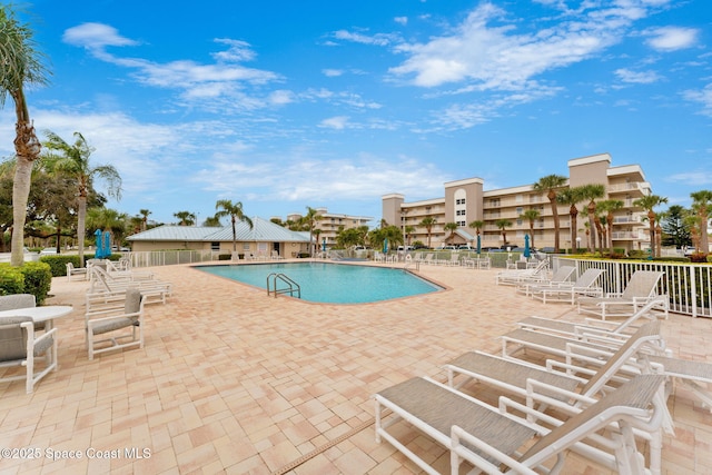 602 Shorewood Dr Unit A201, Cape Canaveral, FL 32920 - community pool with a patio and fence