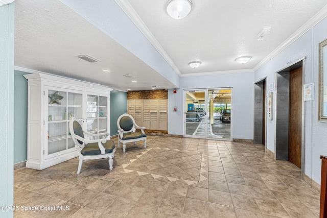 sitting room with ornamental molding, a textured ceiling, and baseboards