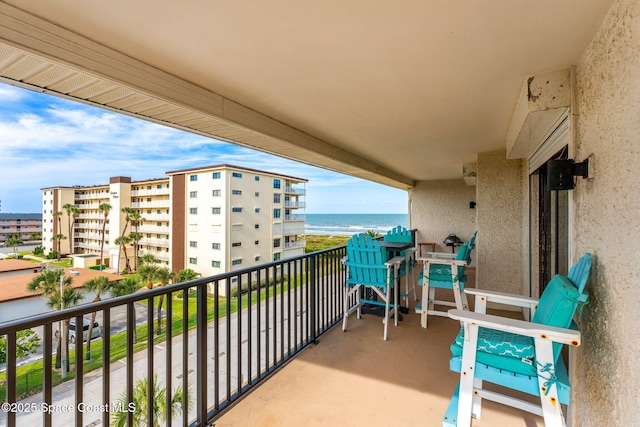 balcony featuring a water view