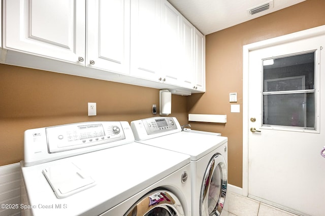 laundry room featuring independent washer and dryer, light tile patterned flooring, cabinet space, baseboards, and visible vents