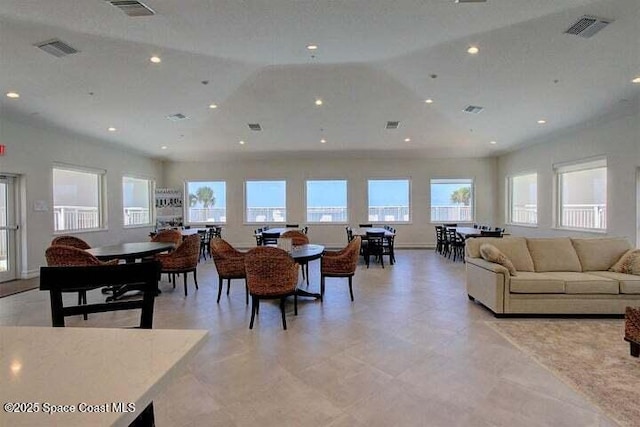 dining area with plenty of natural light, vaulted ceiling, and recessed lighting