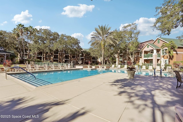 7667 N Wickham Rd Unit 208, Melbourne, FL 32940 - community pool with a patio and fence