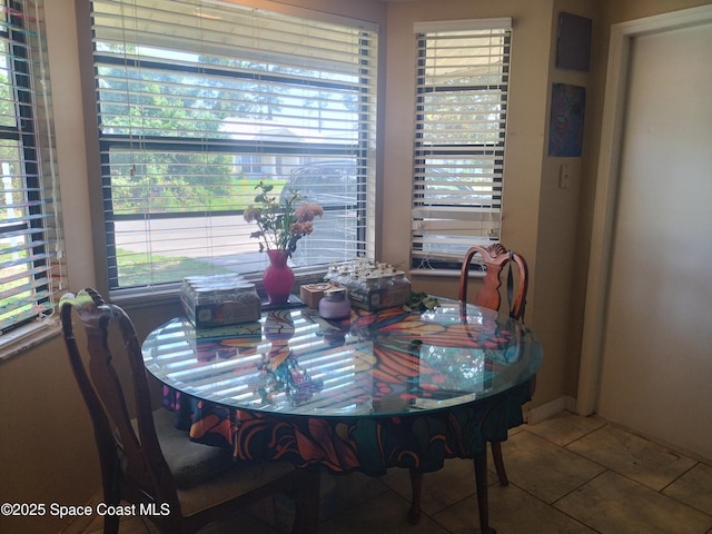 5670 Brandon St, Cocoa, FL 32927 - dining area featuring tile patterned flooring and plenty of natural light
