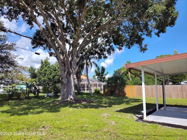 view of yard featuring fence and a patio area
