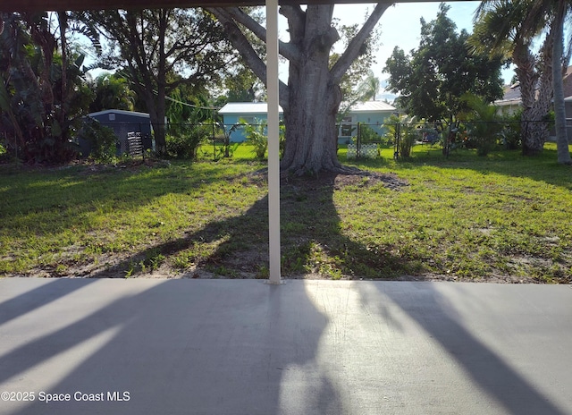 view of yard featuring fence and a patio area