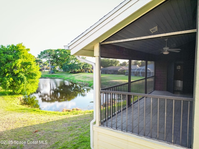 3564 Muirfield Dr Unit 4, Titusville, FL 32780 - wooden terrace with a water view, a lawn, and ceiling fan