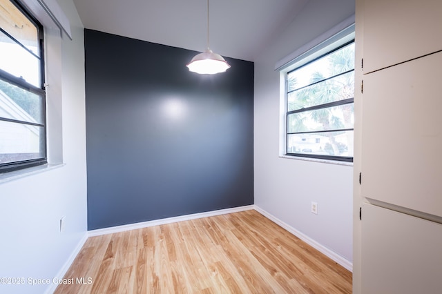 3564 Muirfield Dr Unit 4, Titusville, FL 32780 - unfurnished room featuring light wood-style floors and baseboards