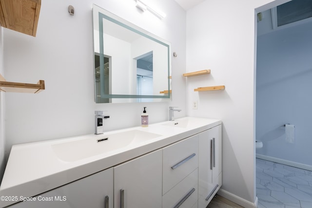 3564 Muirfield Dr Unit 4, Titusville, FL 32780 - full bath featuring double vanity, toilet, and baseboards