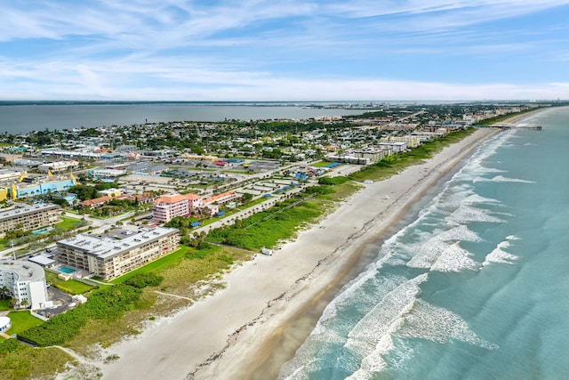 aerial view with a view of the beach and a water view