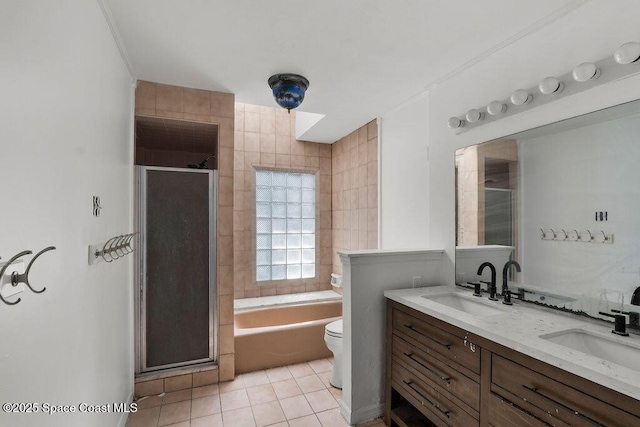 full bath with a sink, tile patterned floors, and a shower stall