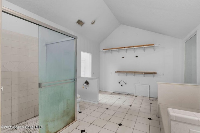 bathroom with toilet, tile patterned floors, a shower stall, lofted ceiling, and visible vents
