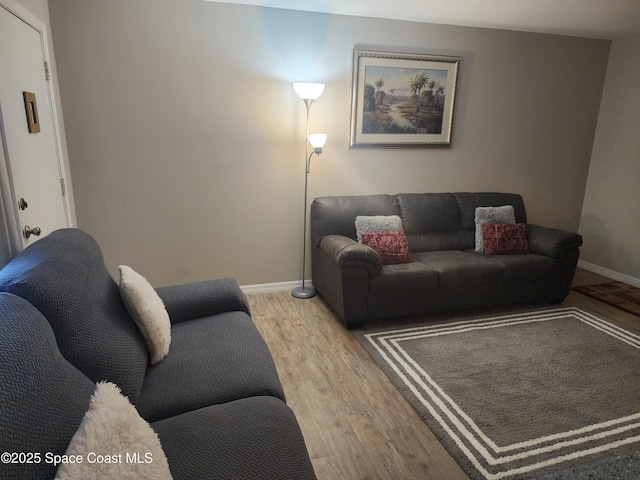 5600 N Banana River Blvd Unit 26, Cocoa Beach, FL 32931 - living room featuring light wood-style flooring and baseboards