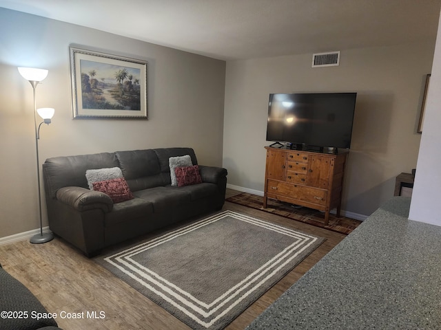 5600 N Banana River Blvd Unit 26, Cocoa Beach, FL 32931 - living area featuring wood finished floors and baseboards