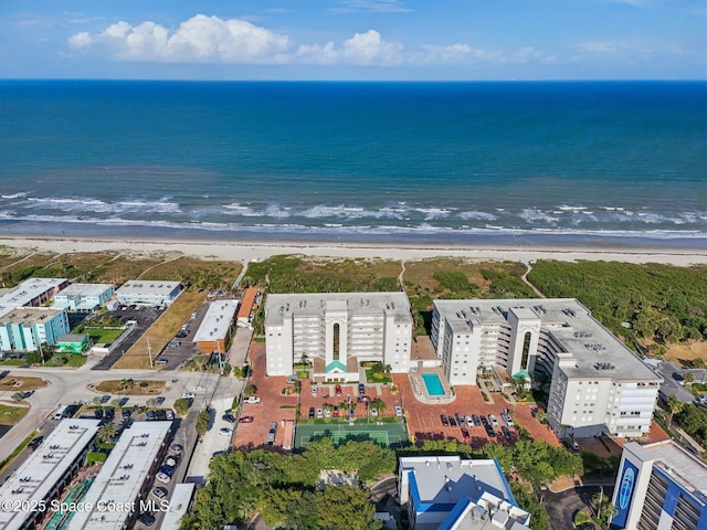 aerial overview of property's location featuring unending shoreline and apartment complex